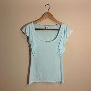 Light blue t shirt ruffled. XS